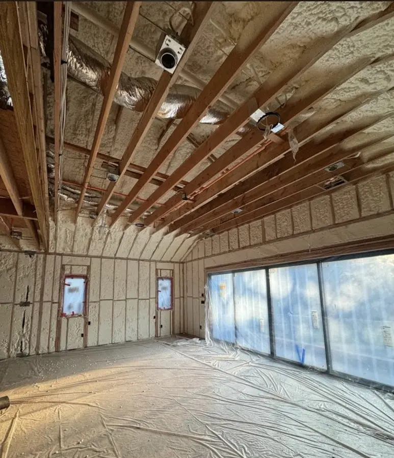Interior walls and ceiling insulated with spray foam during new construction in Bozeman
